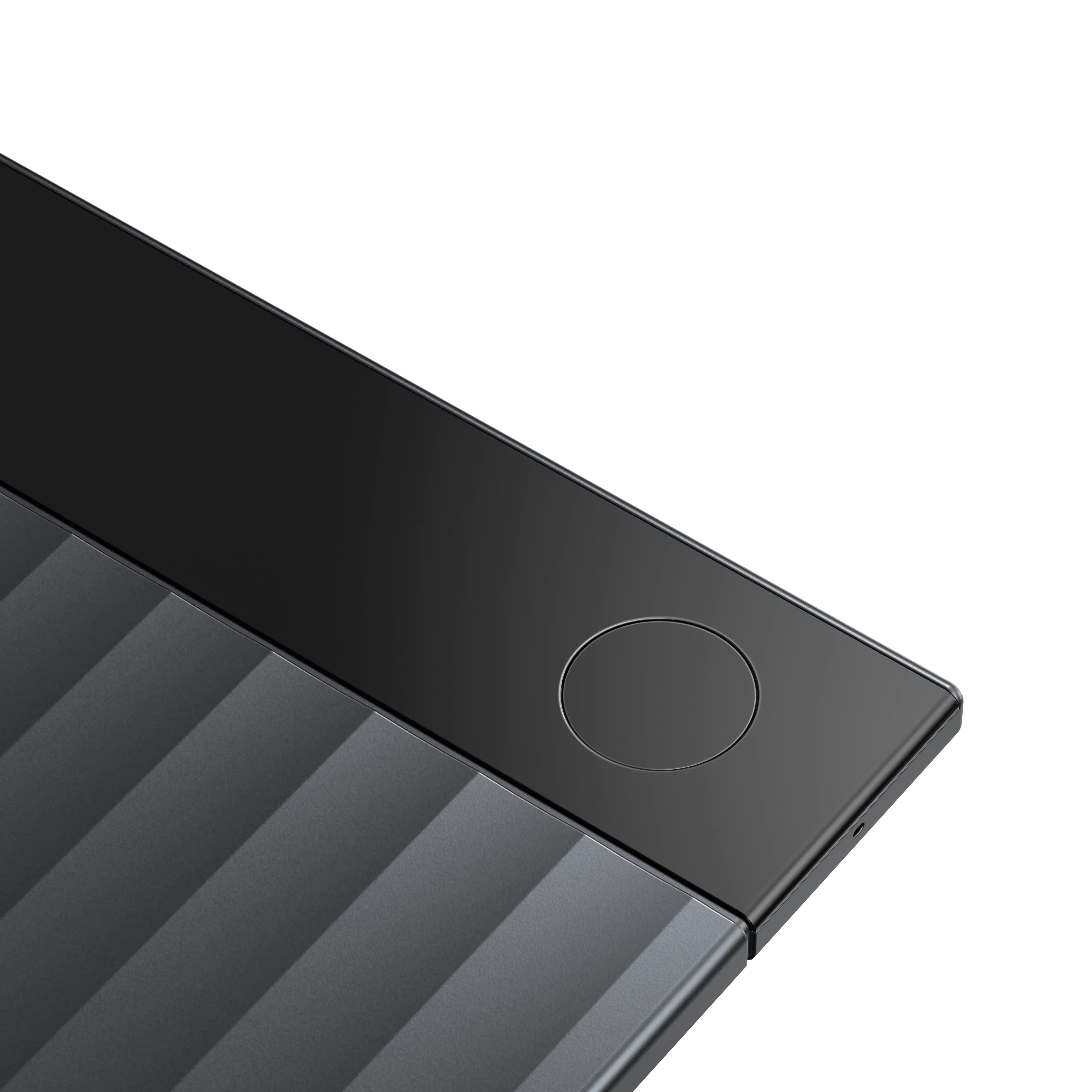 Close-up of Plaud Note Pro featuring distinctive gray ribbed body design with functional circular button, premium AI voice recorder for meetings and calls